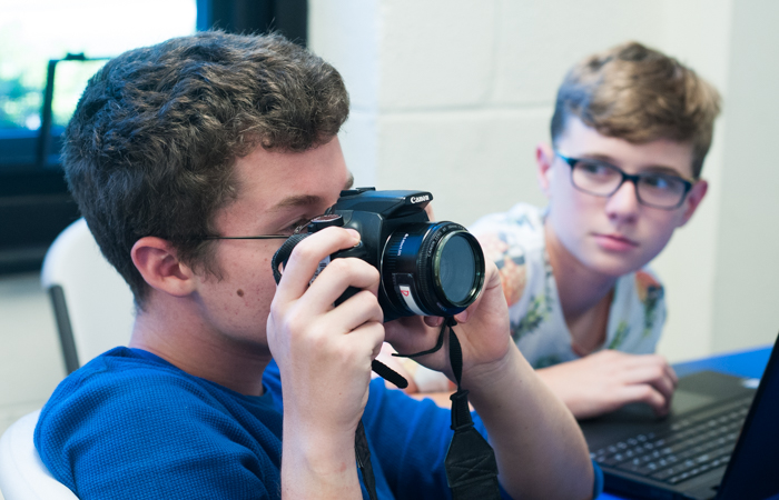 A student experiments with a DSLR.
